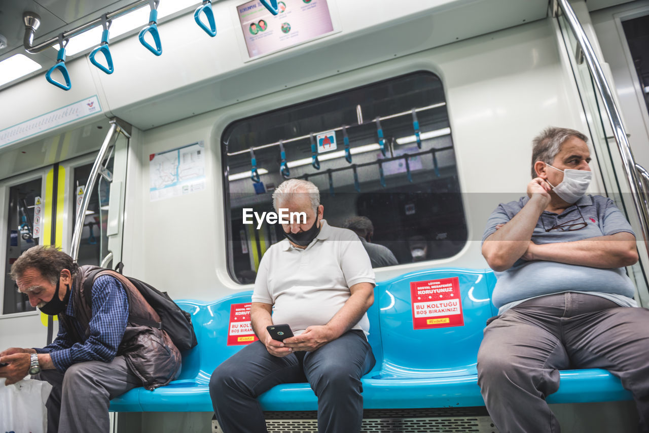 PEOPLE SITTING IN BUS