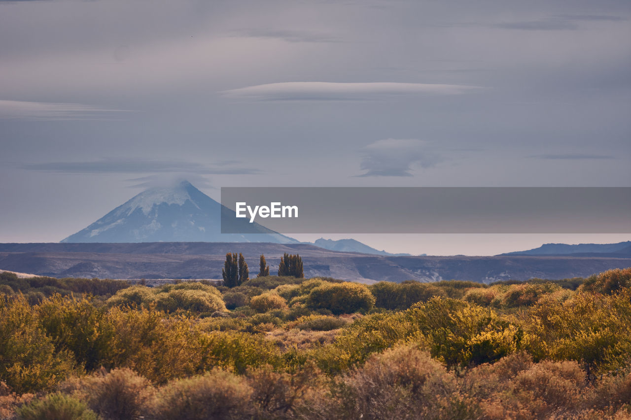 Scenic view of landscape against cloudy sky