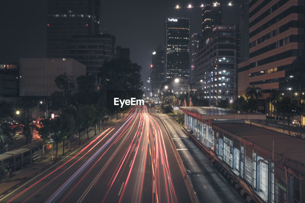 High angle view of light trails on road at night