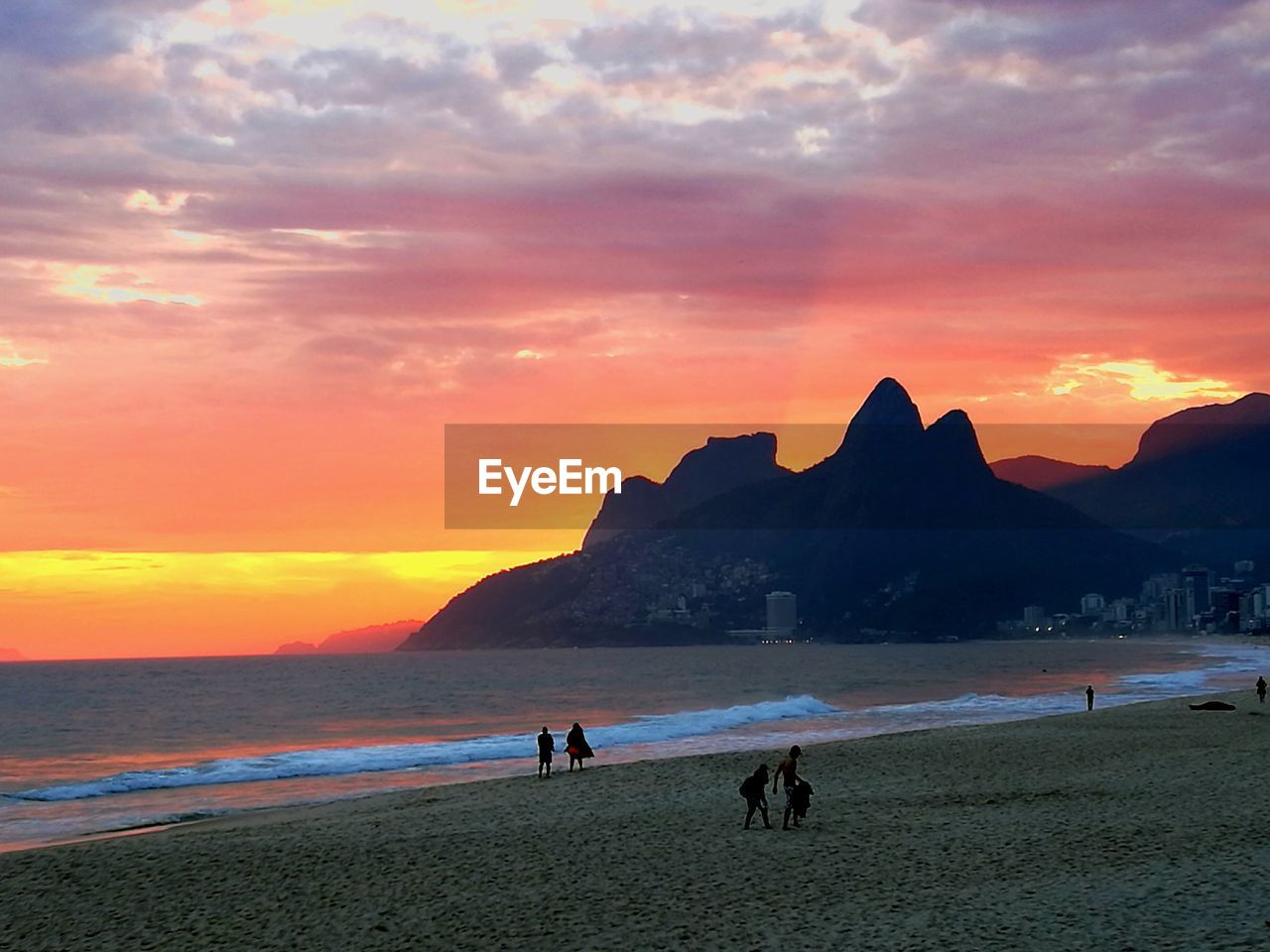 SCENIC VIEW OF BEACH AGAINST SKY DURING SUNSET