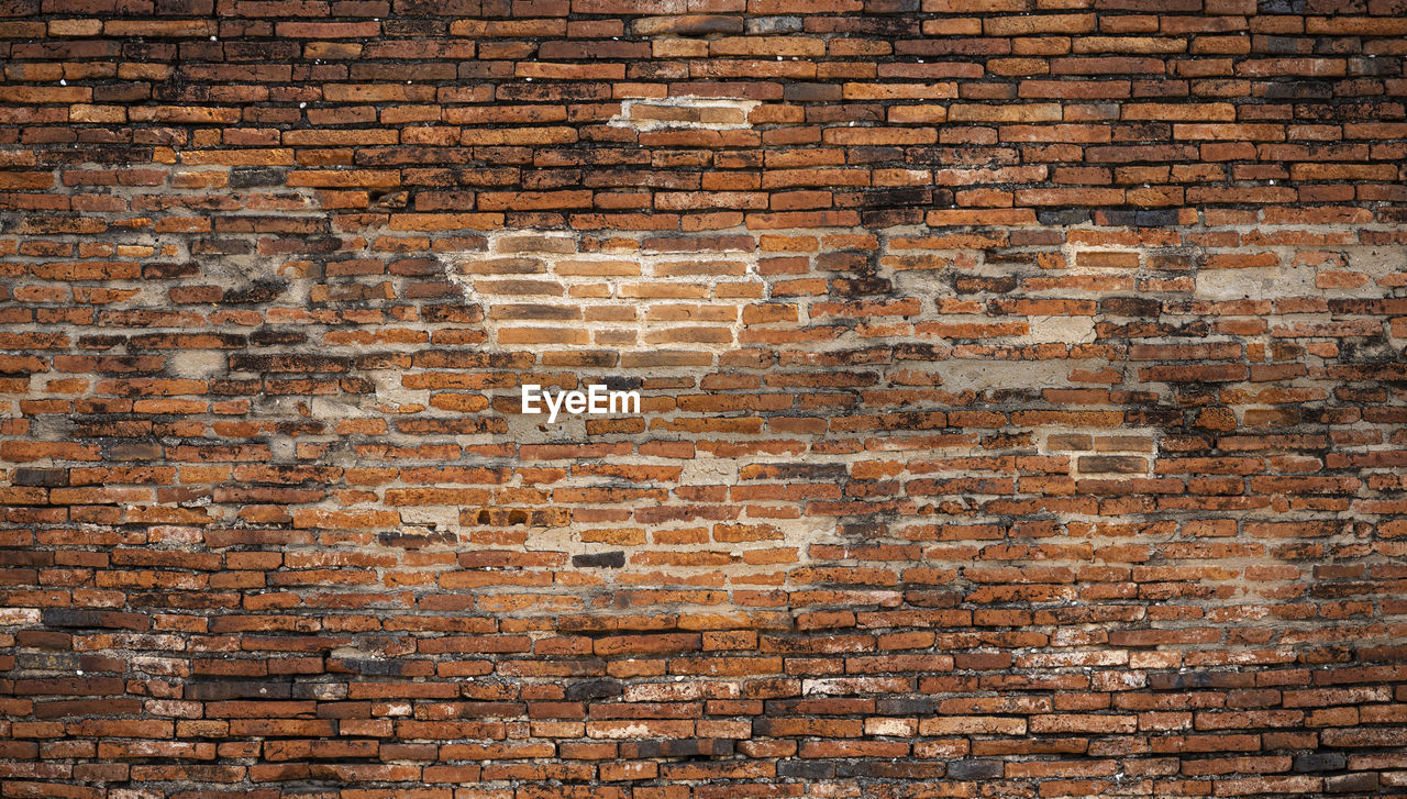 Old brick wall surface detail of temple thai ancient times in thailand