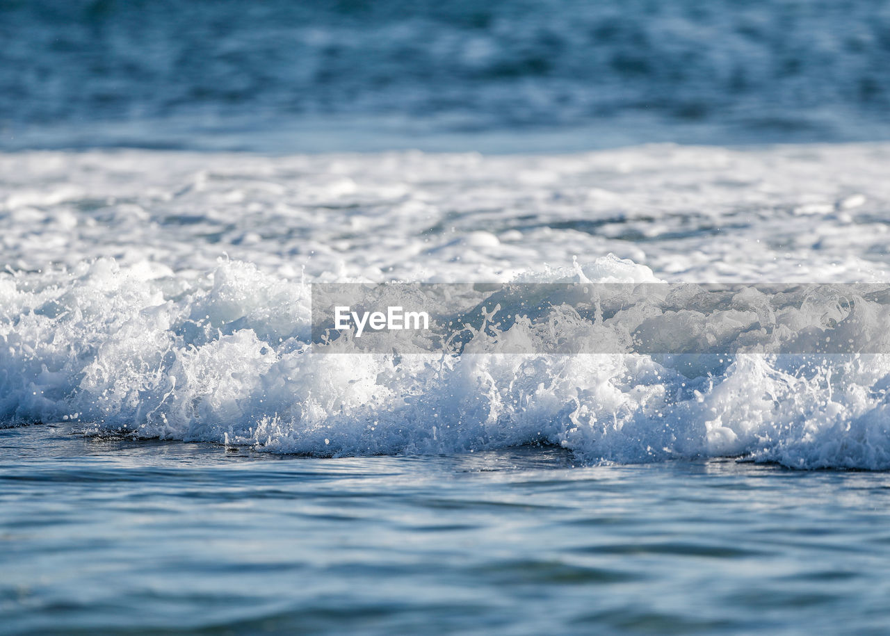 Sea waves splashing on shore