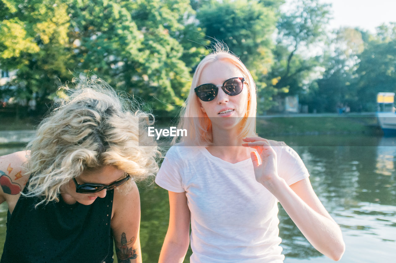 Women sitting and enjoying in boat at river