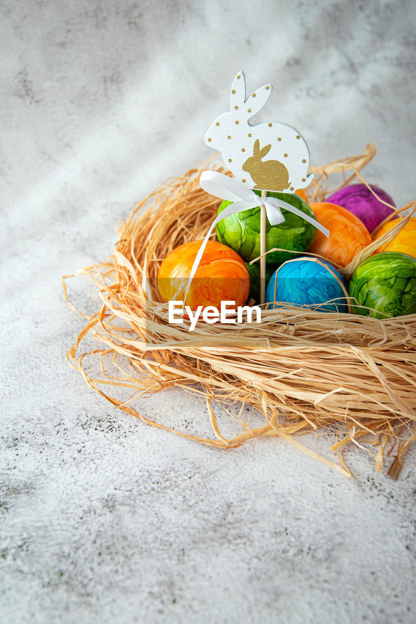 egg, easter, easter egg, tradition, food, basket, celebration, food and drink, holiday, multi colored, container, no people, still life, high angle view, animal nest, freshness, animal egg, nature, indoors, studio shot, decoration, wicker