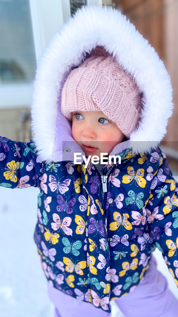 Portrait of cute girl in snow