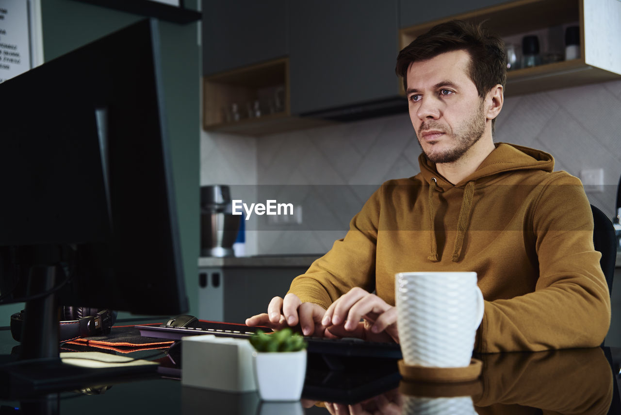 Man working late remotely at home