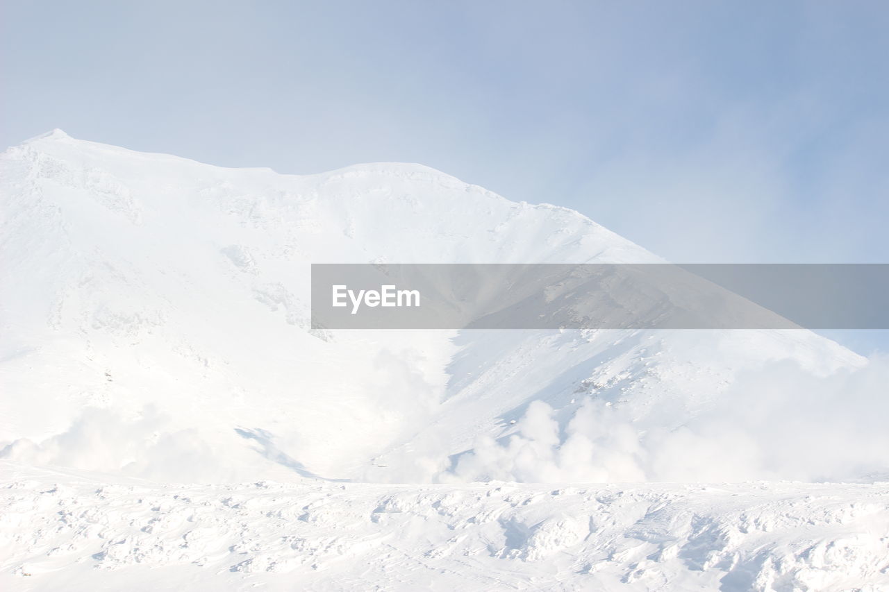 Snow covered mountains against sky