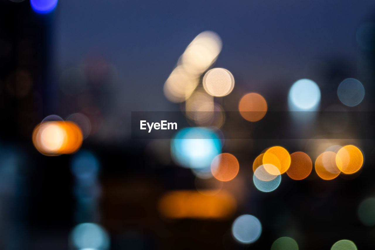 Defocused image of illuminated lights at night