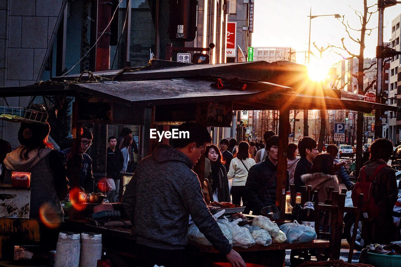 GROUP OF PEOPLE AT MARKET