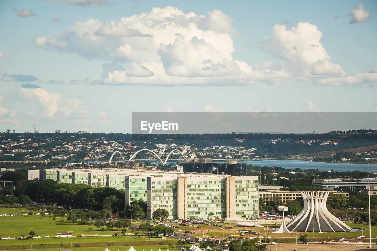 High angle view of buildings in city against sky