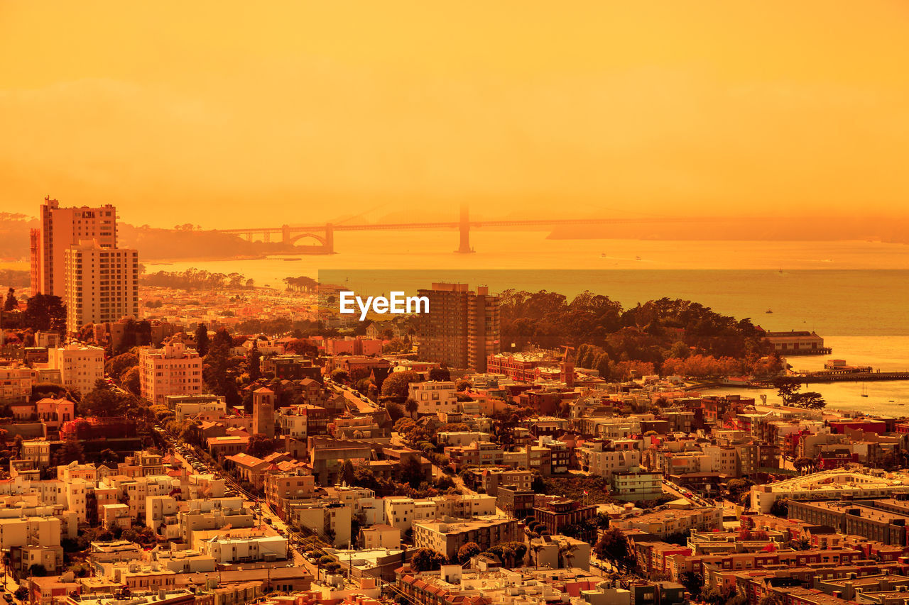 HIGH ANGLE VIEW OF CITY BUILDINGS DURING SUNSET