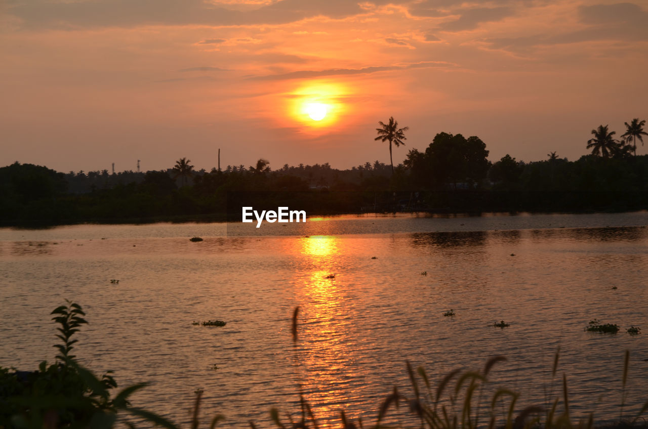 SCENIC VIEW OF LAKE DURING SUNSET