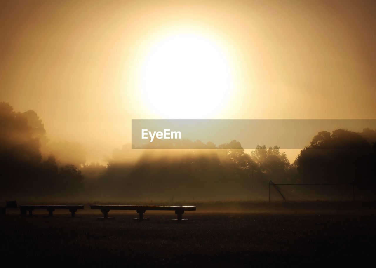 VIEW OF FIELD AGAINST SKY DURING SUNSET