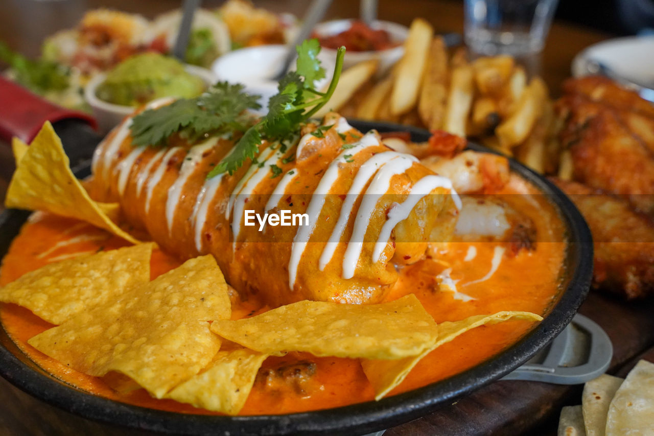 CLOSE-UP OF FOOD SERVED ON TABLE