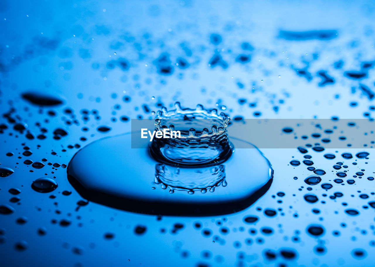 Close-up of water drop on glass