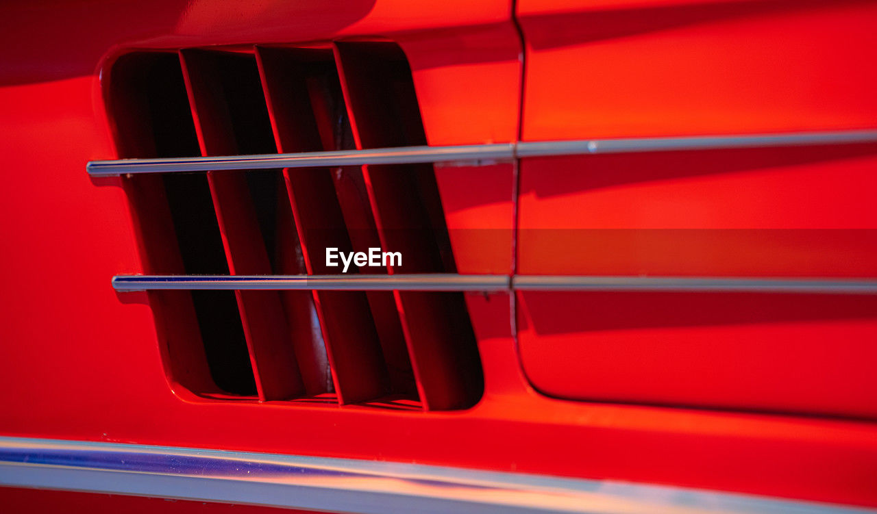 red, car, automotive exterior, automobile, vehicle, bumper, luxury vehicle, no people, transportation, wheel, close-up, mode of transportation