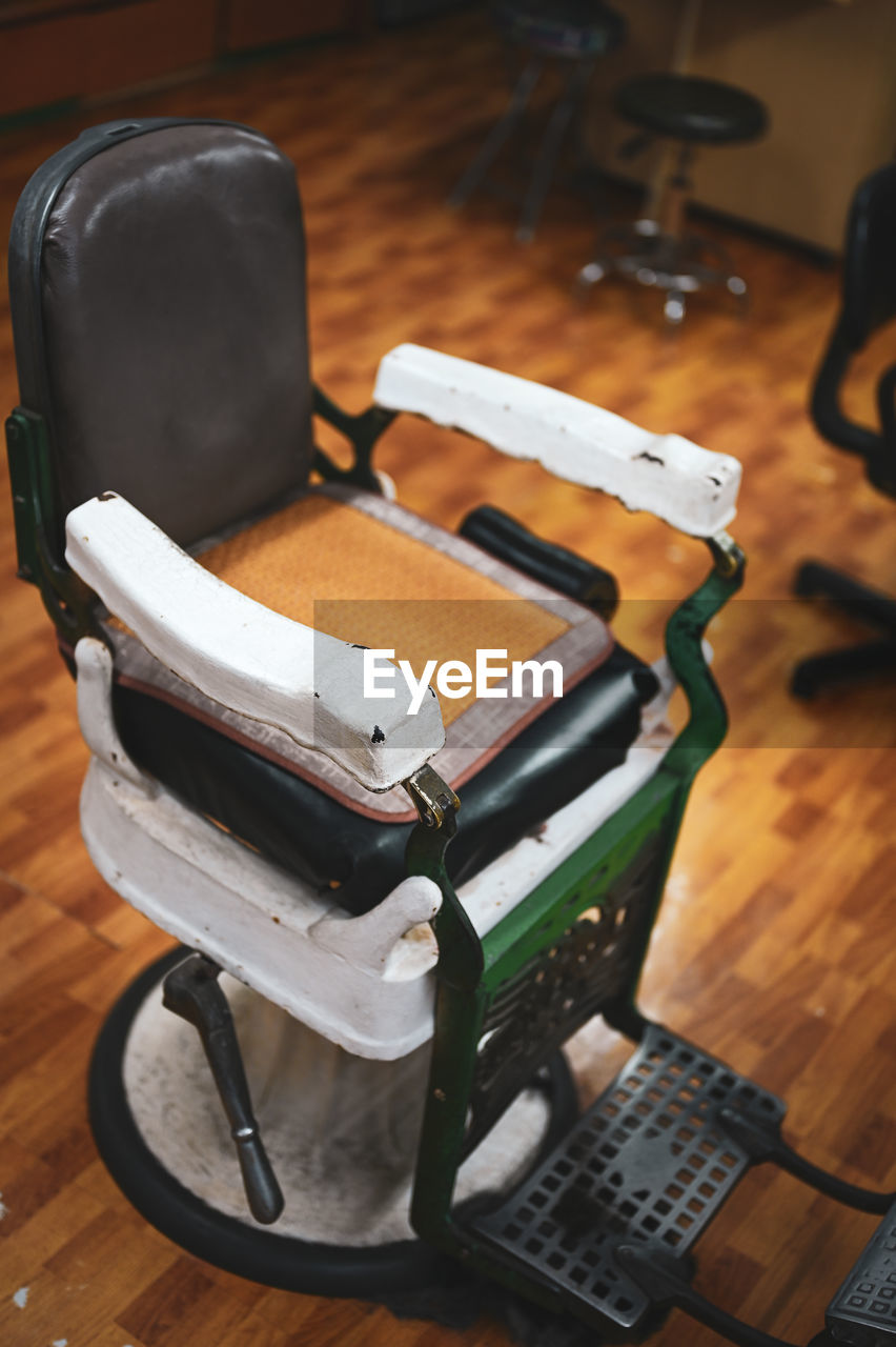 indoors, no people, flooring, wood, chair, hardwood floor, technology, table, seat