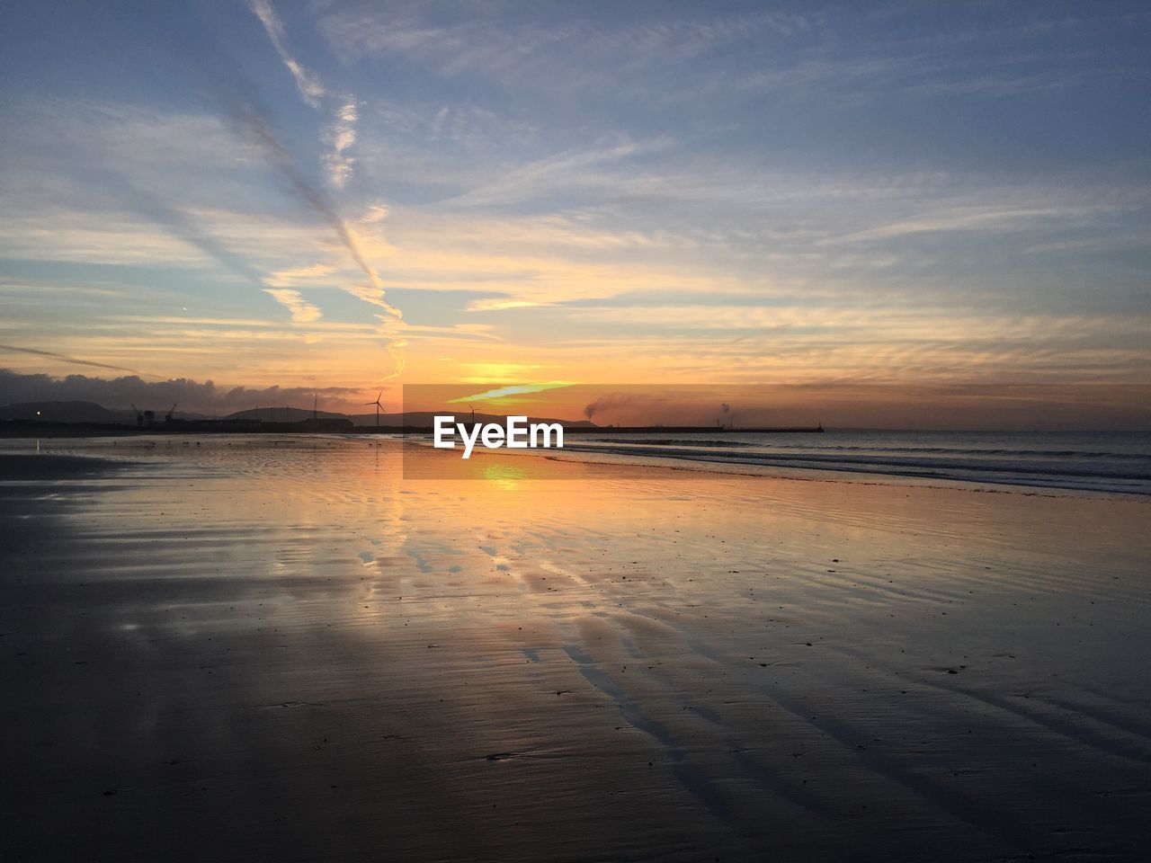 Scenic view of sea against sky during sunset