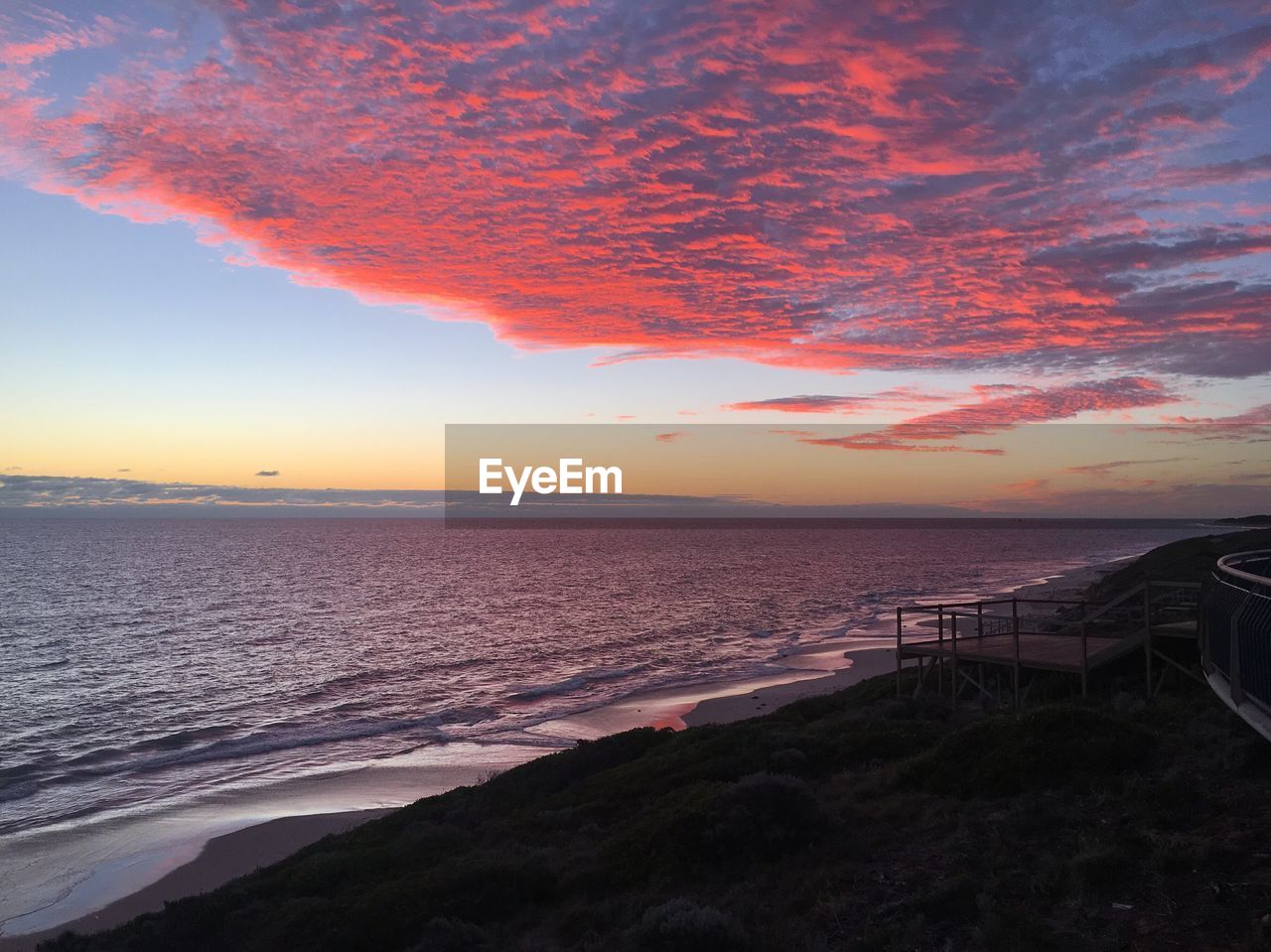 Scenic view of sea against sky at sunset