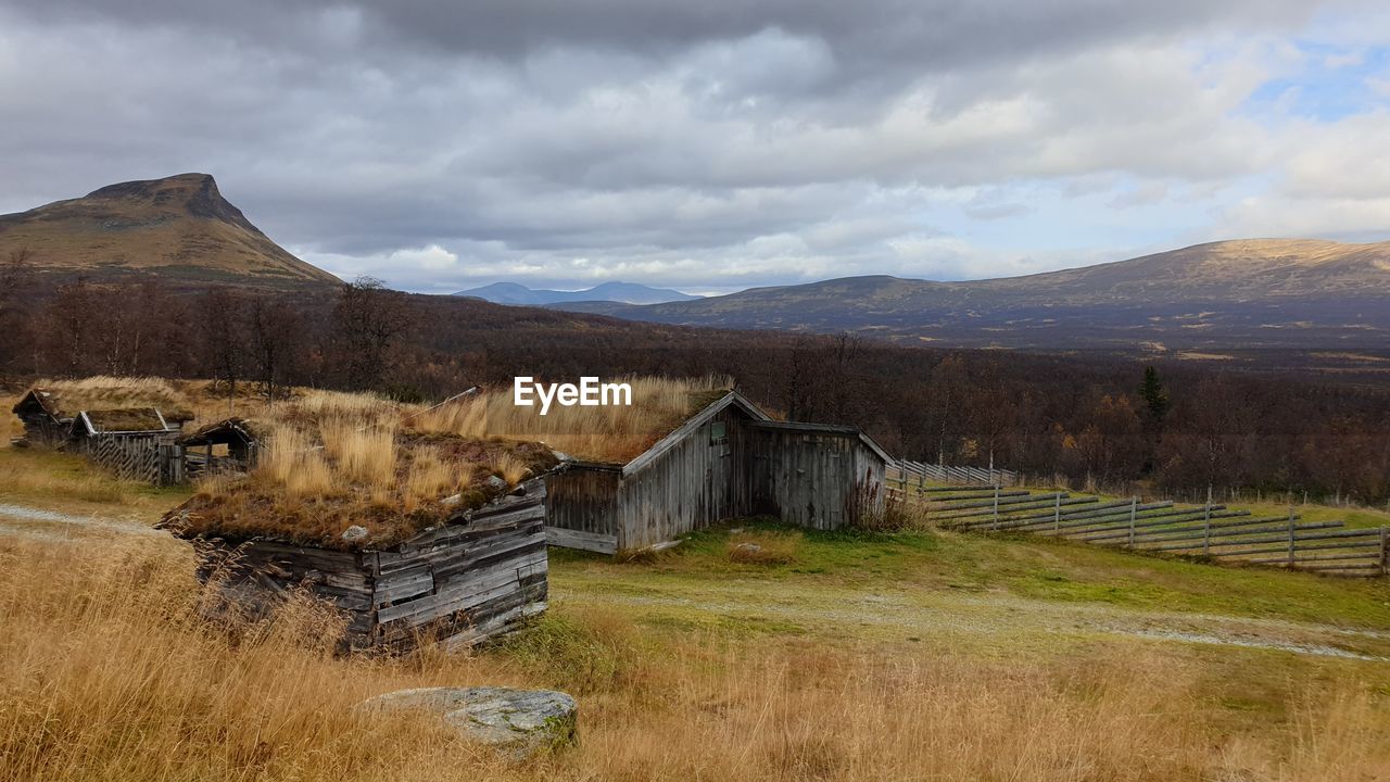 BUILT STRUCTURE ON FIELD AGAINST SKY