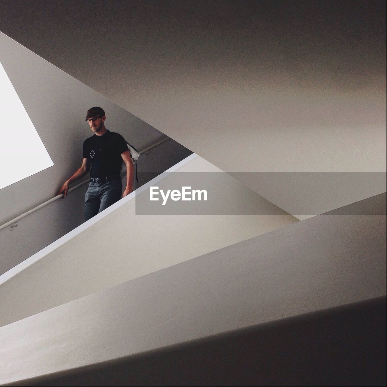 Man walking down on stairs in modern building