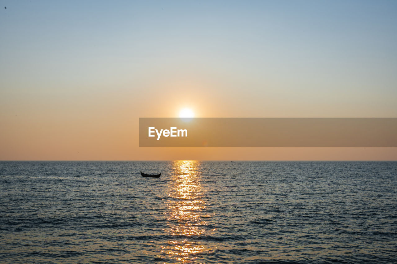 Scenic view of sea against sky during sunset in kerala 