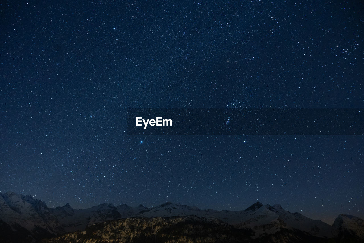 Low angle view of star field against sky at night