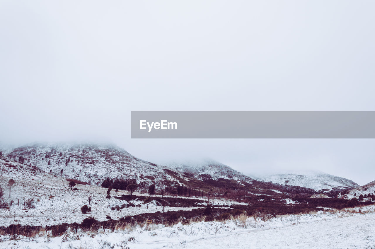 Scenic view of snowcapped mountain against sky