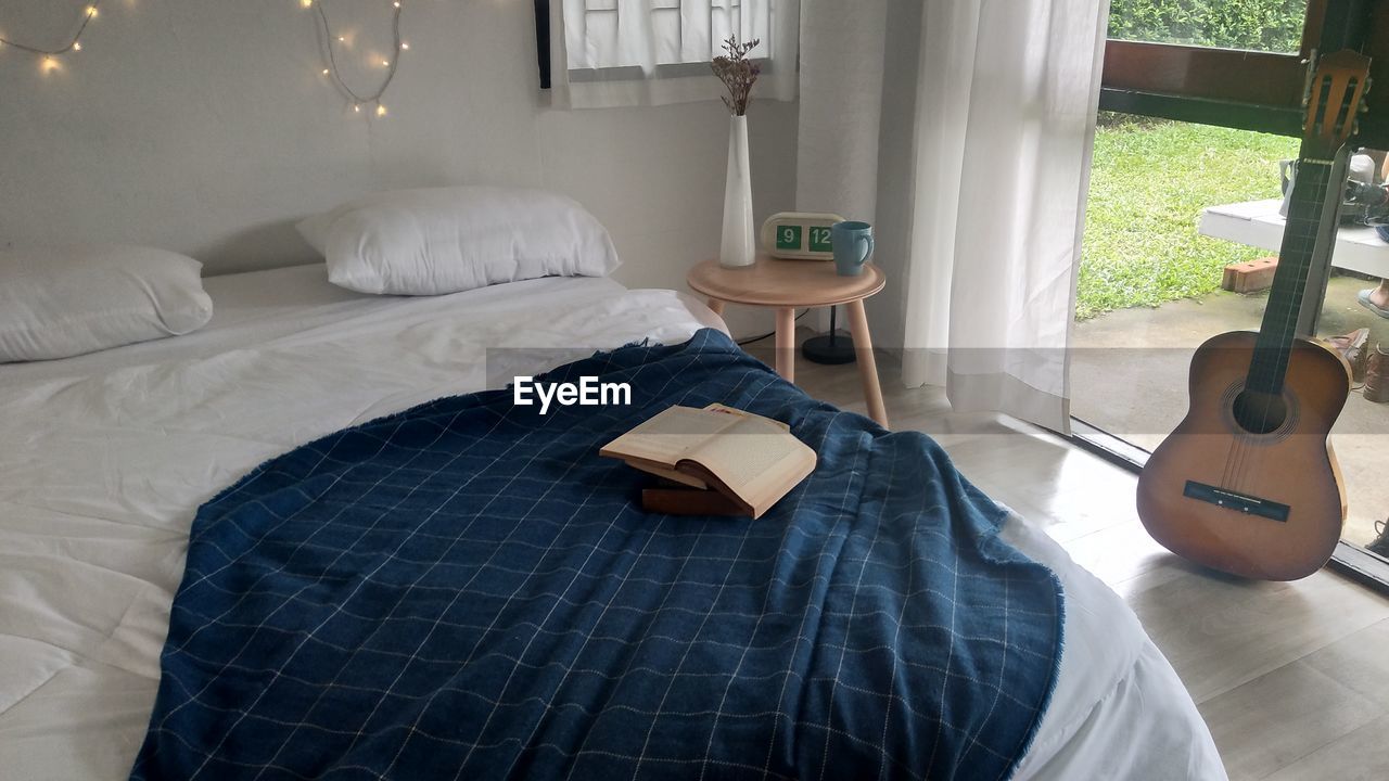 Book on bed at home