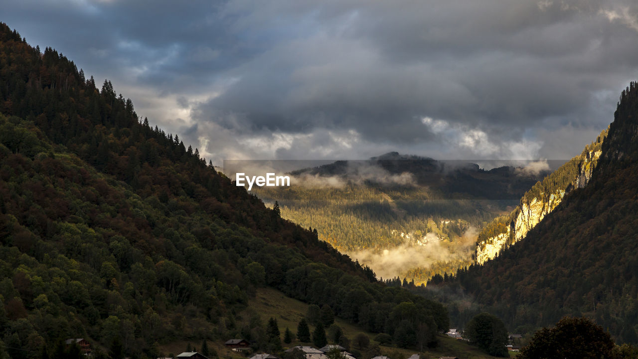 Scenic view of mountains against sky at sunset