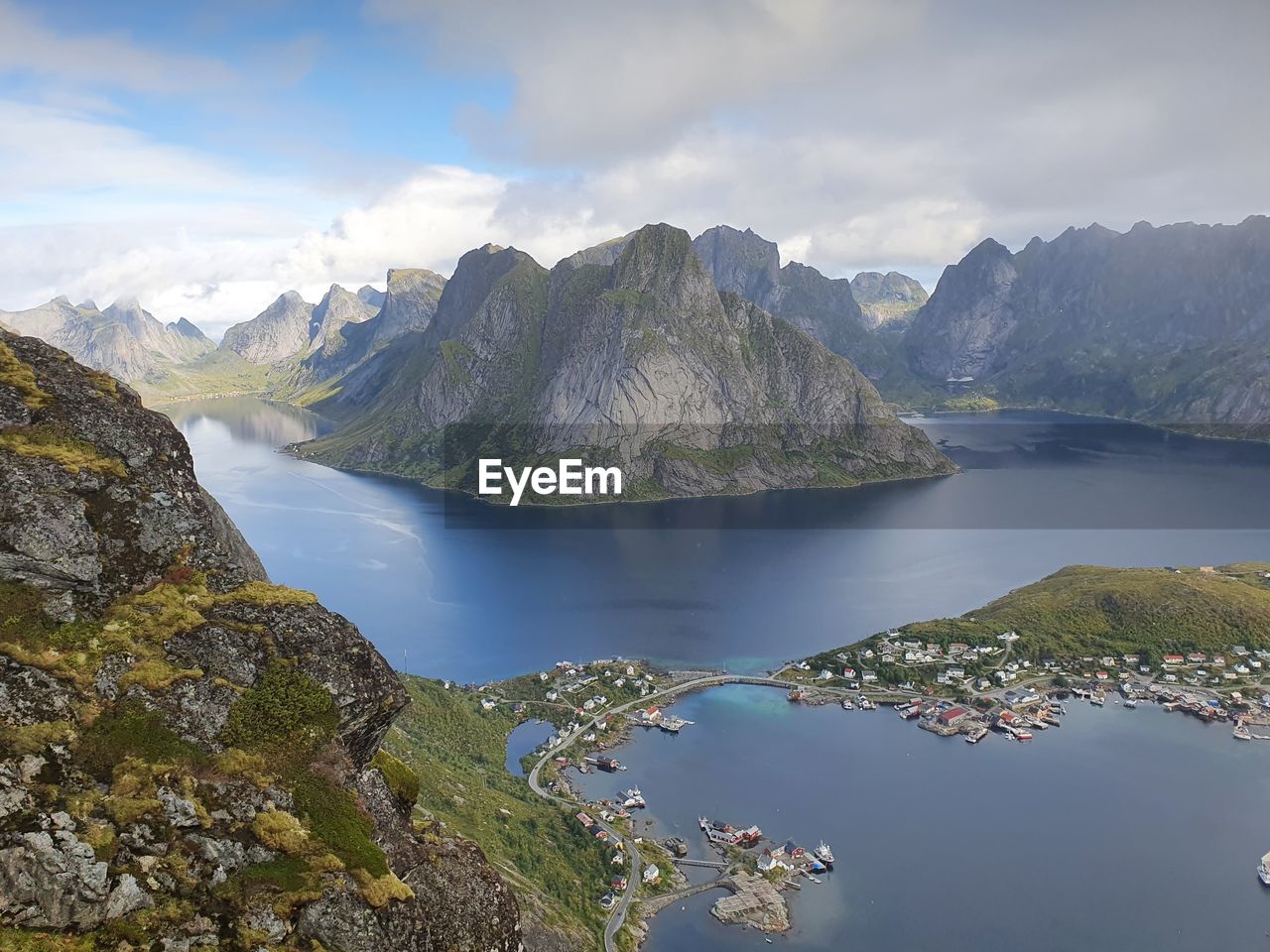 Scenic view of sea, archipelago and mountains against sky