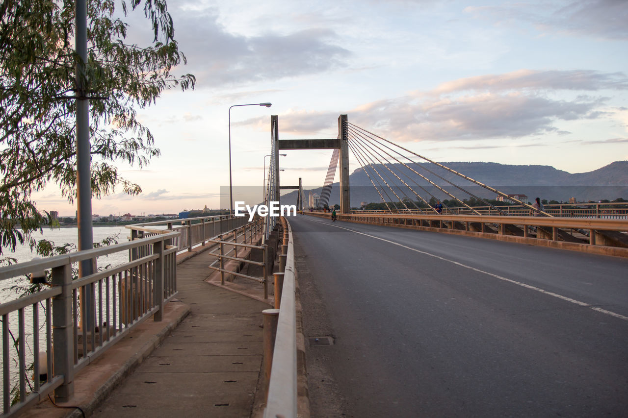 BRIDGE OVER ROAD AGAINST SKY