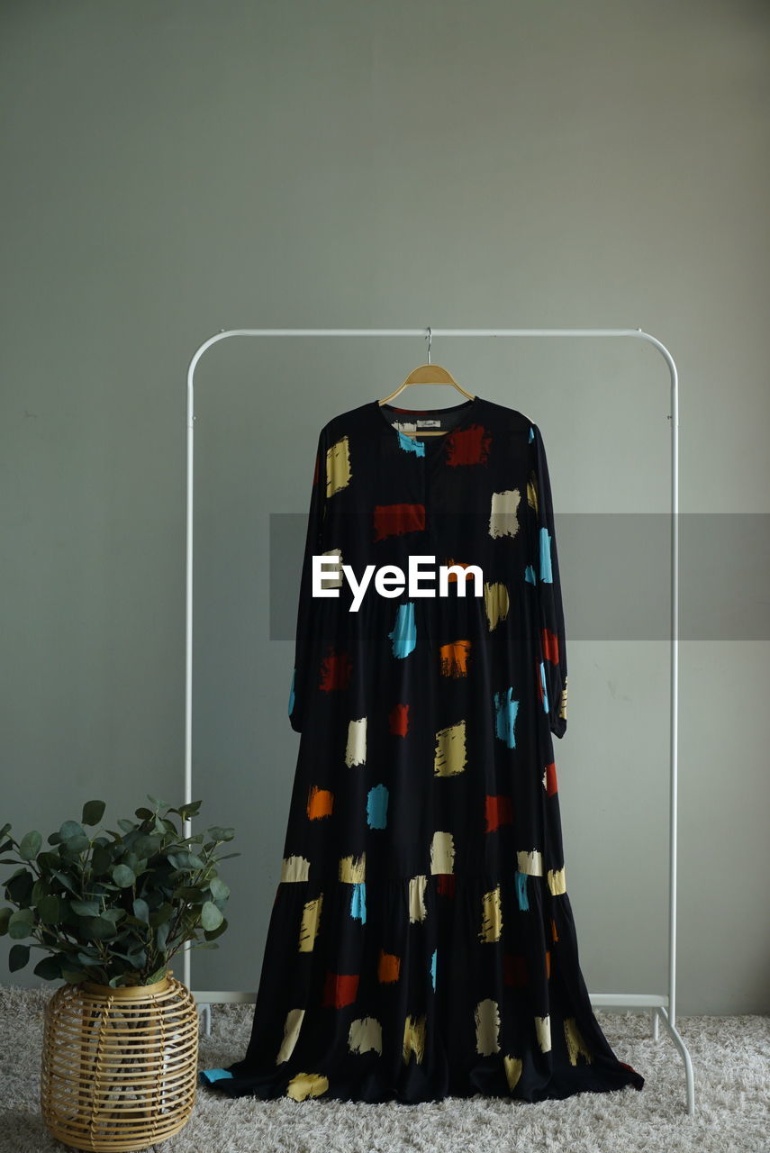 CLOTHES HANGING ON WALL
