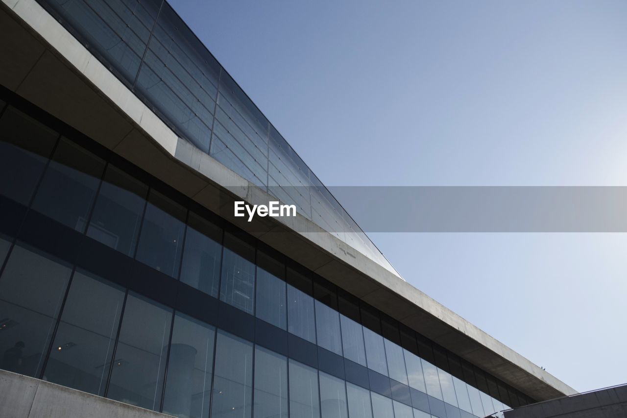 Low angle view of museum at acropolis against clear blue sky