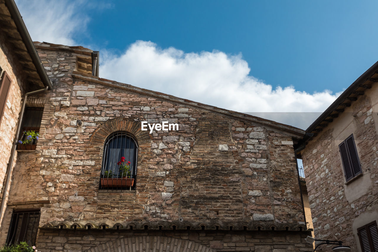 Low angle view of old building against sky