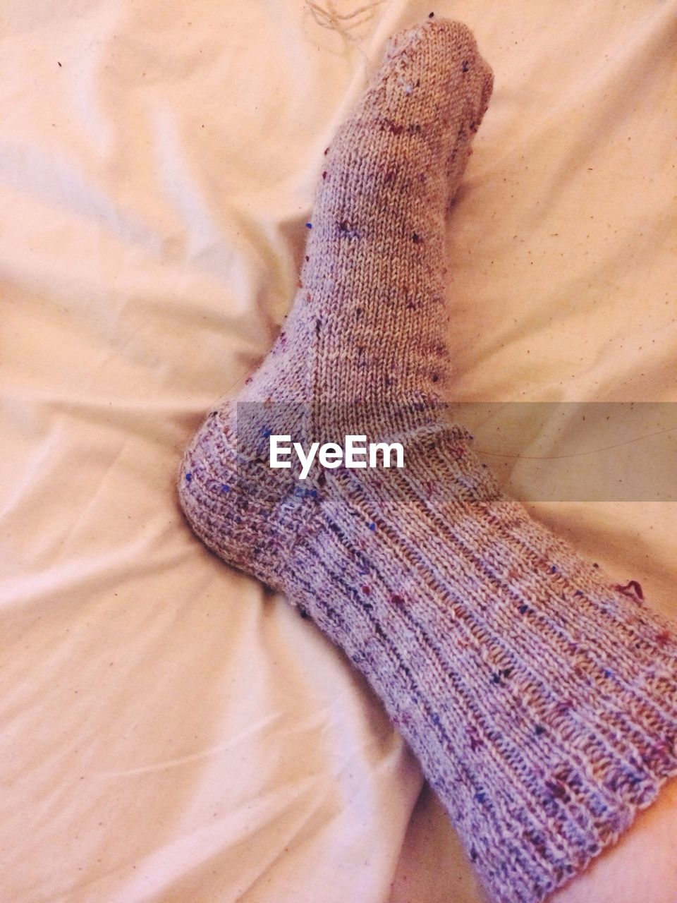 Close-up human wearing sock