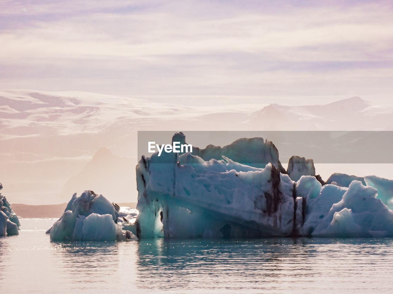 PANORAMIC VIEW OF FROZEN LAKE AGAINST SKY DURING WINTER