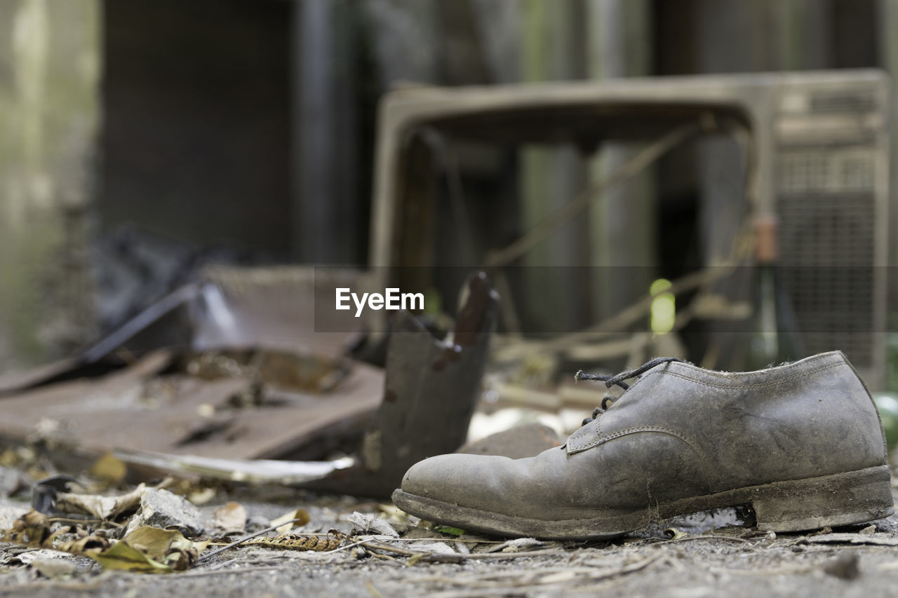 CLOSE-UP OF OLD SHOES