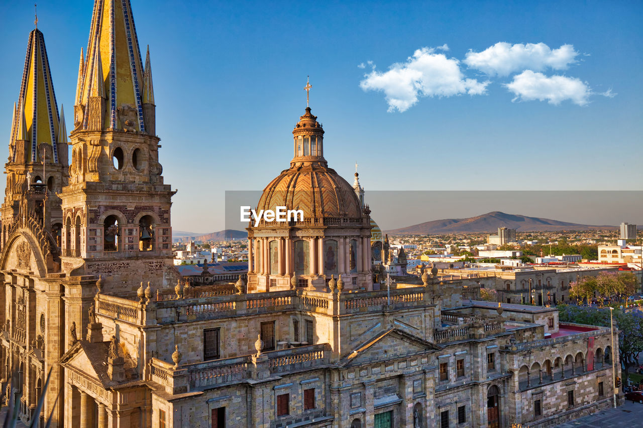 CATHEDRAL OF BUILDINGS AGAINST SKY