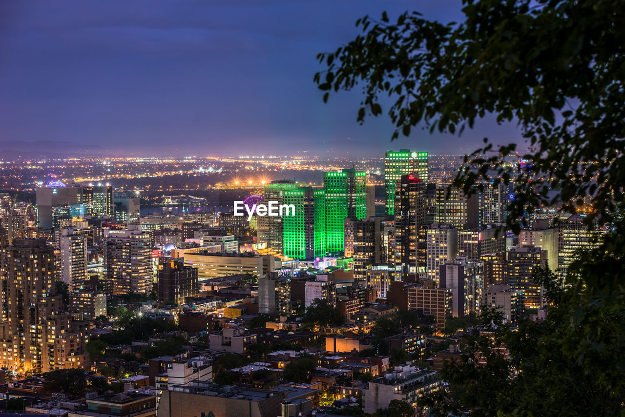 High angle view of illuminated buildings in city