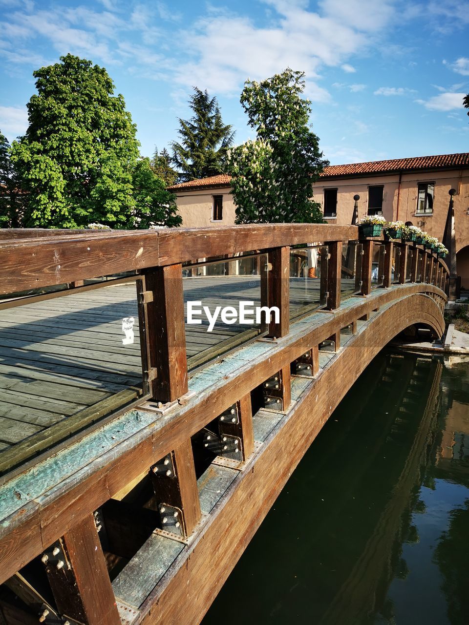 water, architecture, built structure, nature, tree, bridge, sky, plant, wood, no people, reflection, transportation, travel destinations, cloud, day, building exterior, waterway, outdoors, travel, river, city, vacation