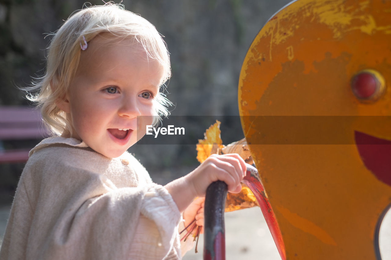 close-up of cute baby girl looking away