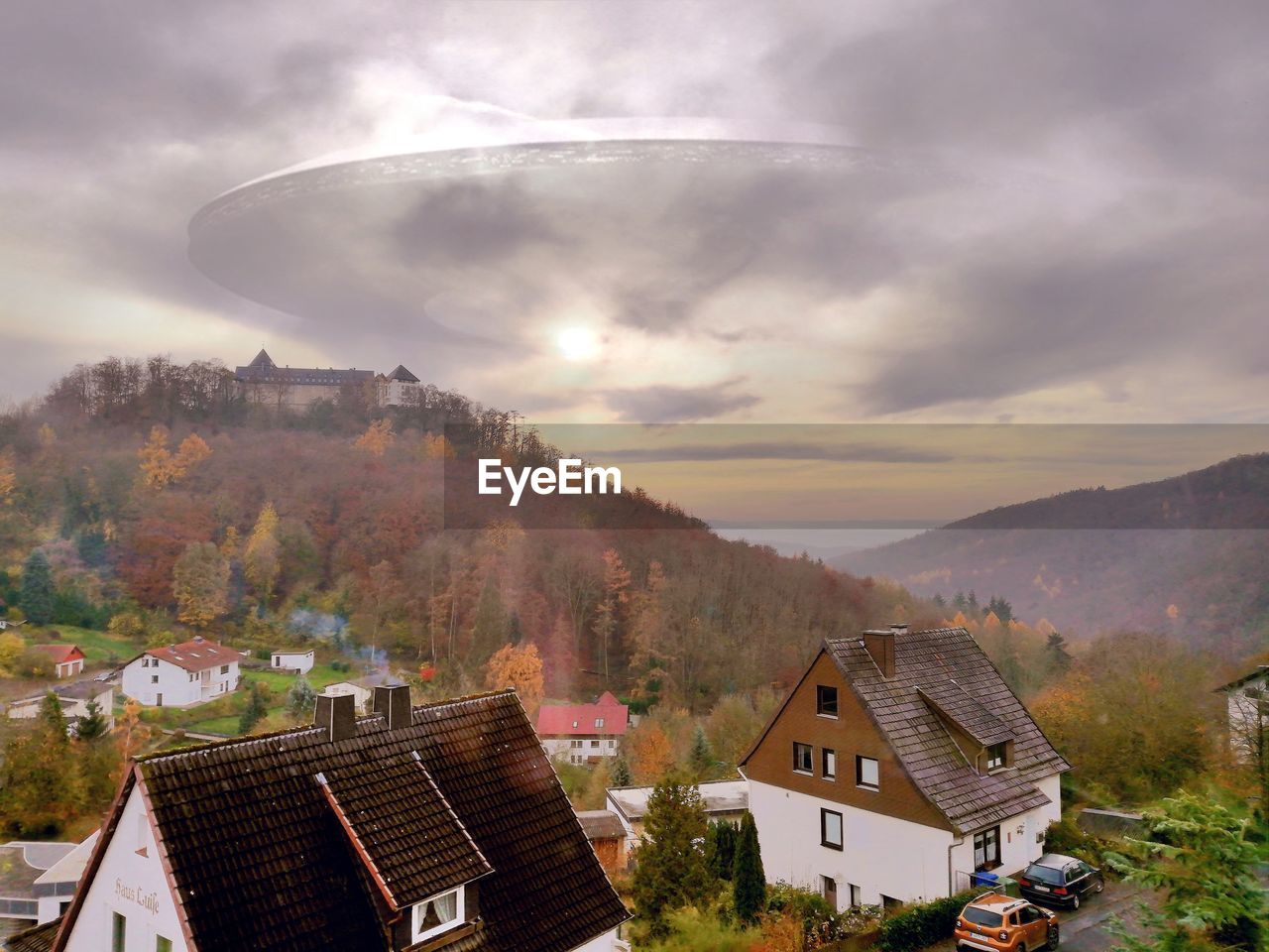 High angle view of houses and buildings against sky