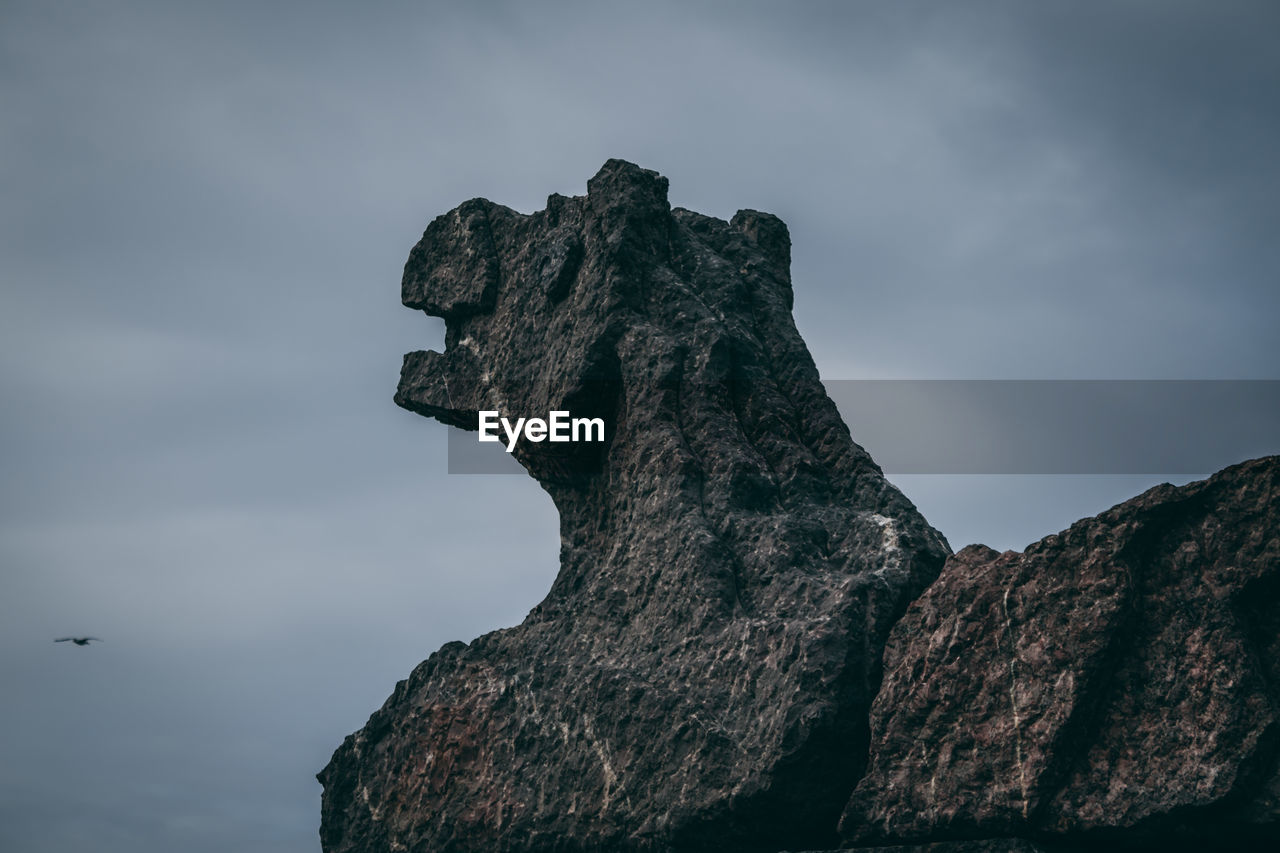 LOW ANGLE VIEW OF ROCK FORMATION