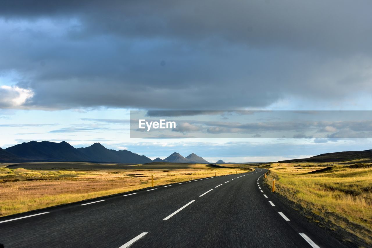 EMPTY ROAD AGAINST CLOUDY SKY