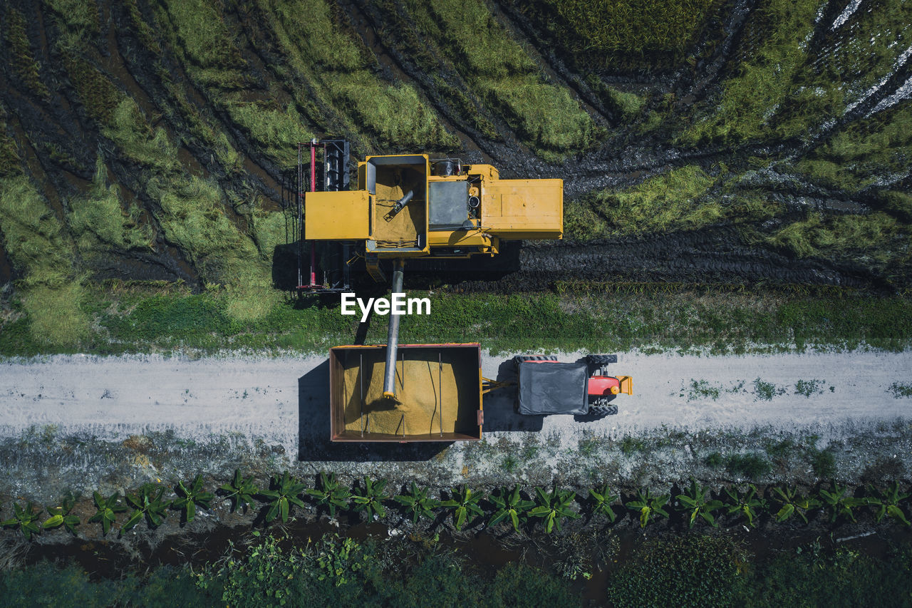 Directly above view of combine harvester on field