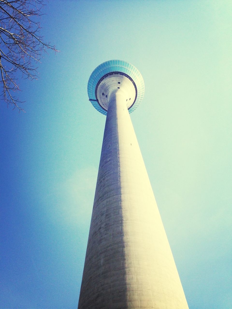 Low angle view of fernsehturm against clear blue sky