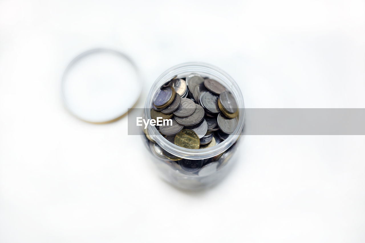 HIGH ANGLE VIEW OF GLASS JAR ON WHITE BACKGROUND