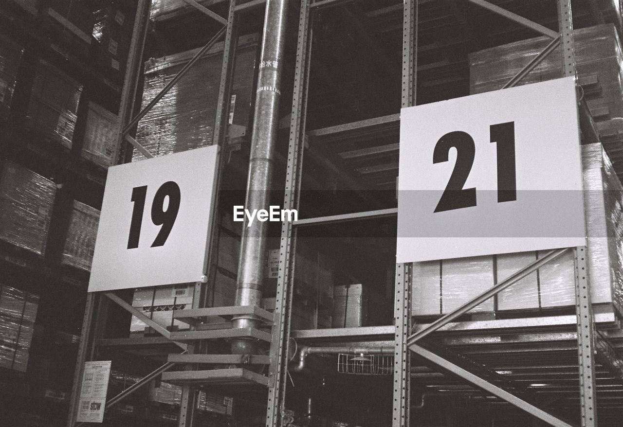 Low angle view of number on shelves in warehouse