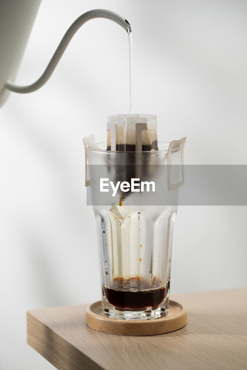 close-up of coffee in glass on table